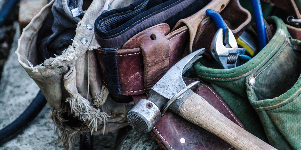 Hammer and tool belt, ready for handyman work